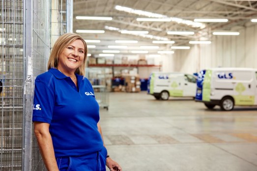 GLS employee at depot with electric vans